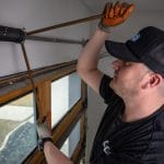 tech working on garage door
