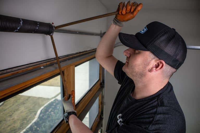 tech working on garage door