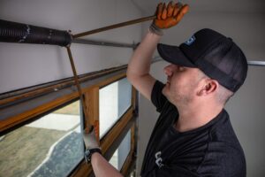 Service tech working on garage door