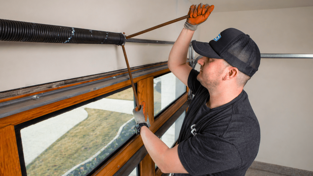 Ogd® technician working on garage door springs