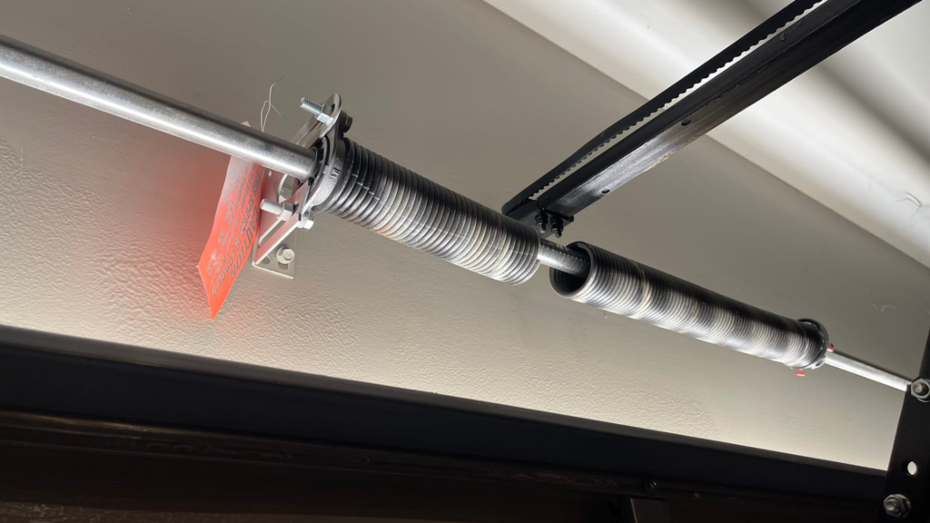 Garage Door Springs: Types, Lifespan, Costs &Amp; When To Call A Pro 3 Broken garage door spring